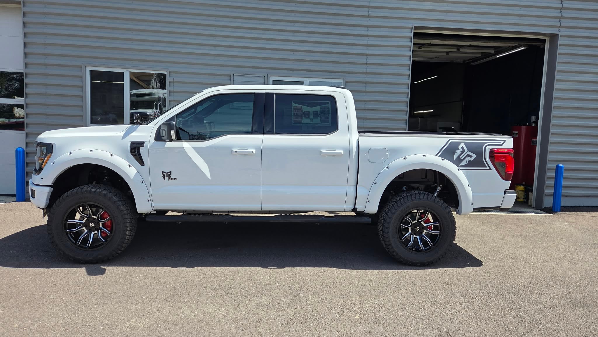 2026 Ford F-150 XLT in Oxford White — front three-quarter view
